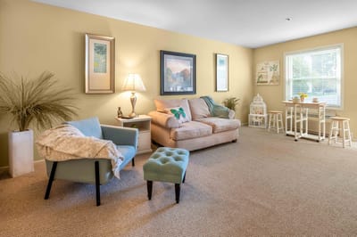 Cozy lounge area with comfortable seating and natural light