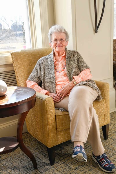 Senior resident in a cozy lounge chair