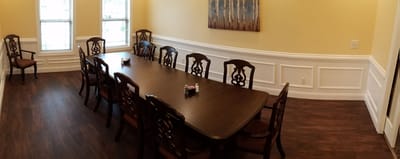 Dining room with a long table and chairs