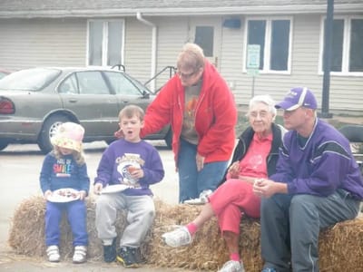 Residents and children enjoying a community event outdoors