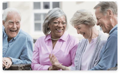Residents enjoying laughter and conversation outdoors
