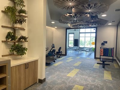 Well-designed fitness area with equipment and seating