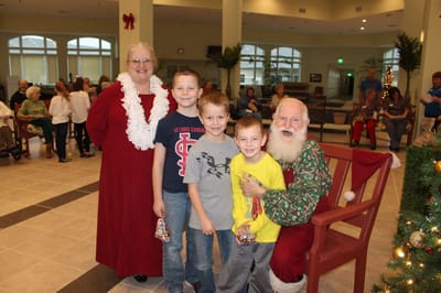 Sunshine Gardens, assisted living in Marion, IL — Santa with children and staff during a festive event