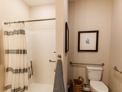 Private bathroom featuring a shower and decor