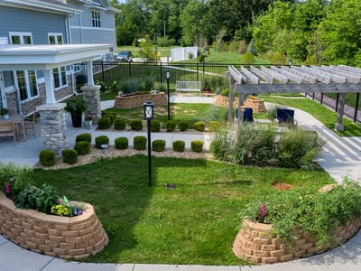 Beautiful landscaped garden area with seating and pathways