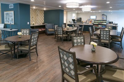 Bright dining area with tables and chairs
