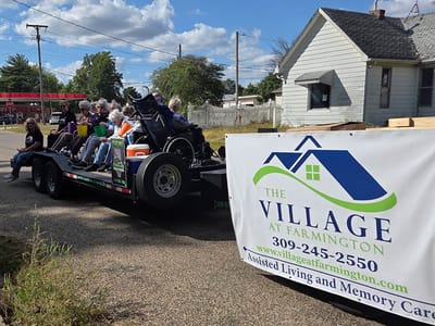 Residents enjoying a community event on a trailer