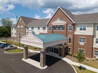 Entrance of Hellenic Senior Living of Elkhart with covered area