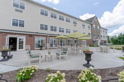 Outdoor seating area of the facility with tables and chairs