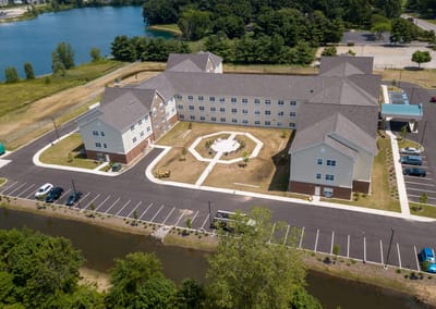 Aerial view of the senior living facility with landscaping