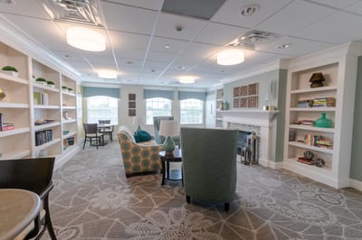 Bright common area with seating and bookshelves