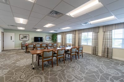Bright common area with tables and chairs