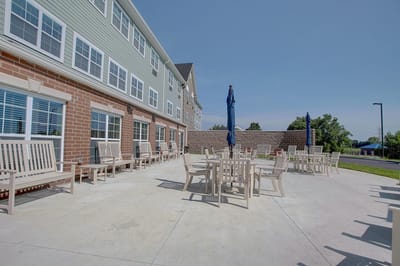Outdoor seating area with tables and chairs