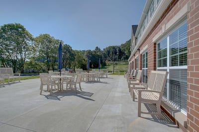 Outdoor seating area with tables and chairs