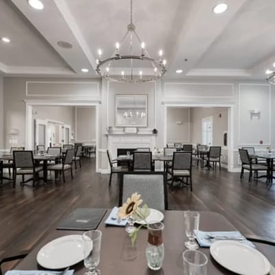 Dining room with tables set for residents