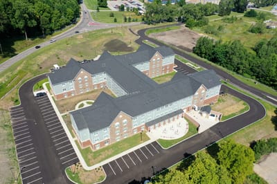 Aerial view of Hellenic Senior Living with parking