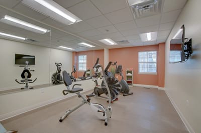 Well-equipped exercise room with cardio machines