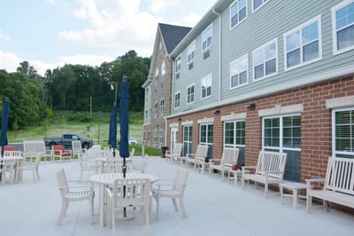 Outdoor seating area with tables and chairs
