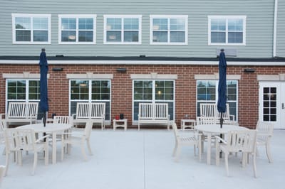 Outdoor seating area with tables and chairs