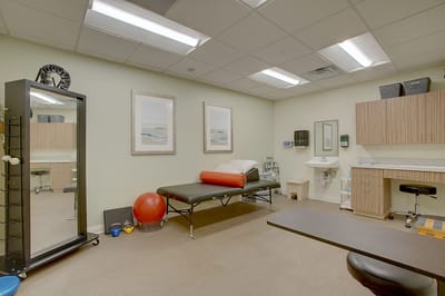Interior view of a treatment room with therapy equipment