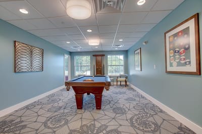 Interior view of a game room with a pool table