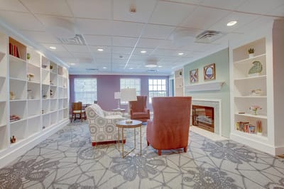 Comfortable common area with seating and shelves