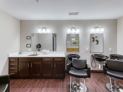 Interior salon area with styling chairs and mirrors