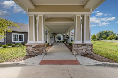 Entrance view of a senior living facility with landscaping