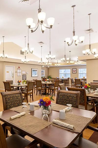 Bright dining room with tables set for meals