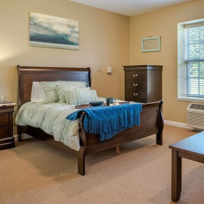 Cozy private resident room with a bed and decor