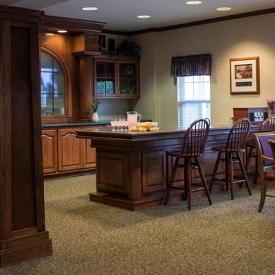 Interior view of a cozy common area with a bar