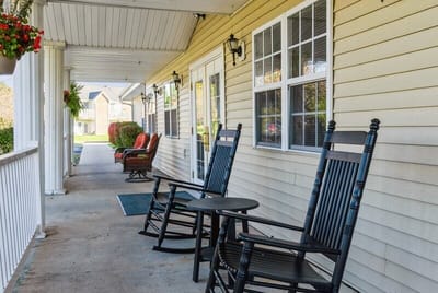 Porch area with rocking chairs and outdoor seating