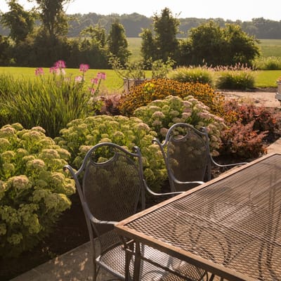 Beautifully landscaped outdoor seating area with flowers