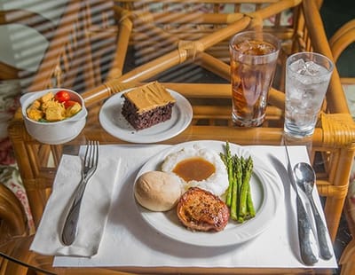 A serving of food on a table with drinks