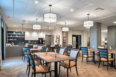 Bright dining area with tables and chairs