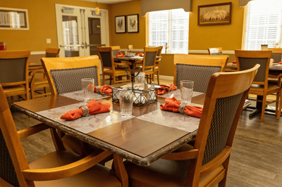 Dining area with neatly arranged table settings