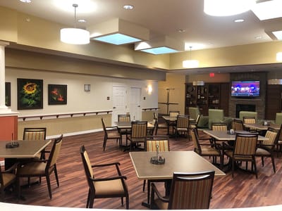 Interior view of a dining room with tables and chairs