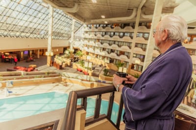 A resident enjoying coffee in the facility's interior