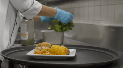 Staff preparing a meal in the kitchen