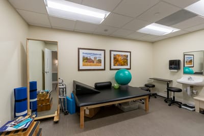 Physical therapy room with exercise equipment