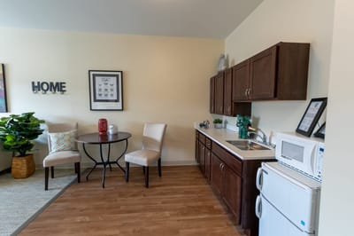 Bright, modern kitchen area in a resident room