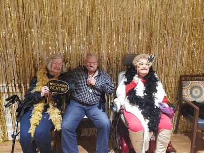 Residents celebrating with props during a party