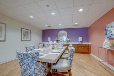 Dining room with a large table and floral decor