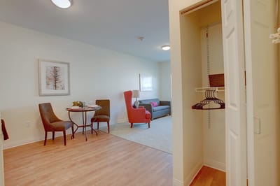 Cozy resident living space with sitting area and closet