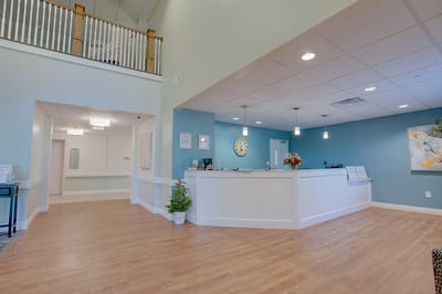Reception area of a senior living facility, bright and welcoming