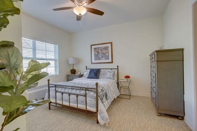 Cozy resident room with a bed and dresser
