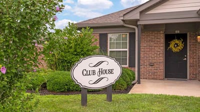 Exterior view of the clubhouse with signage