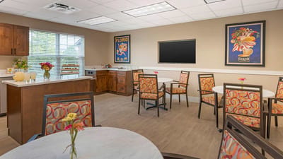 Bright dining area with colorful chairs and tables