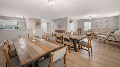 Bright, inviting common area with dining table and seating