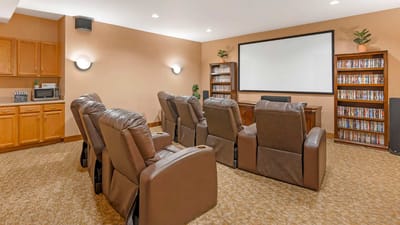 Cozy movie theater room with reclining chairs